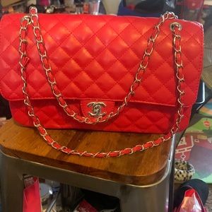 I’m selling and red and silver Chanel purse.